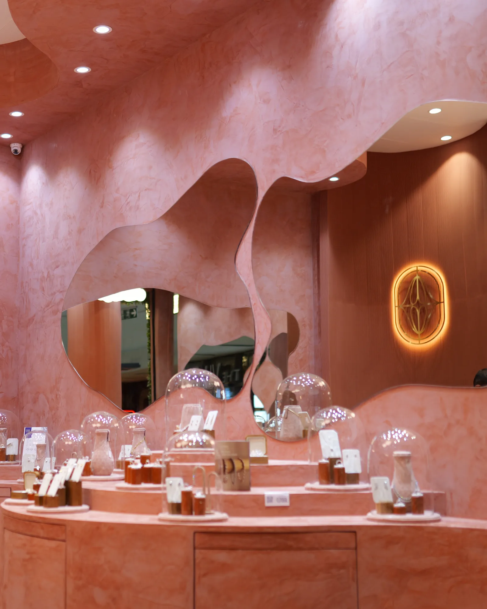 A close-up of Aurique jewellery displayed in the terracotta store